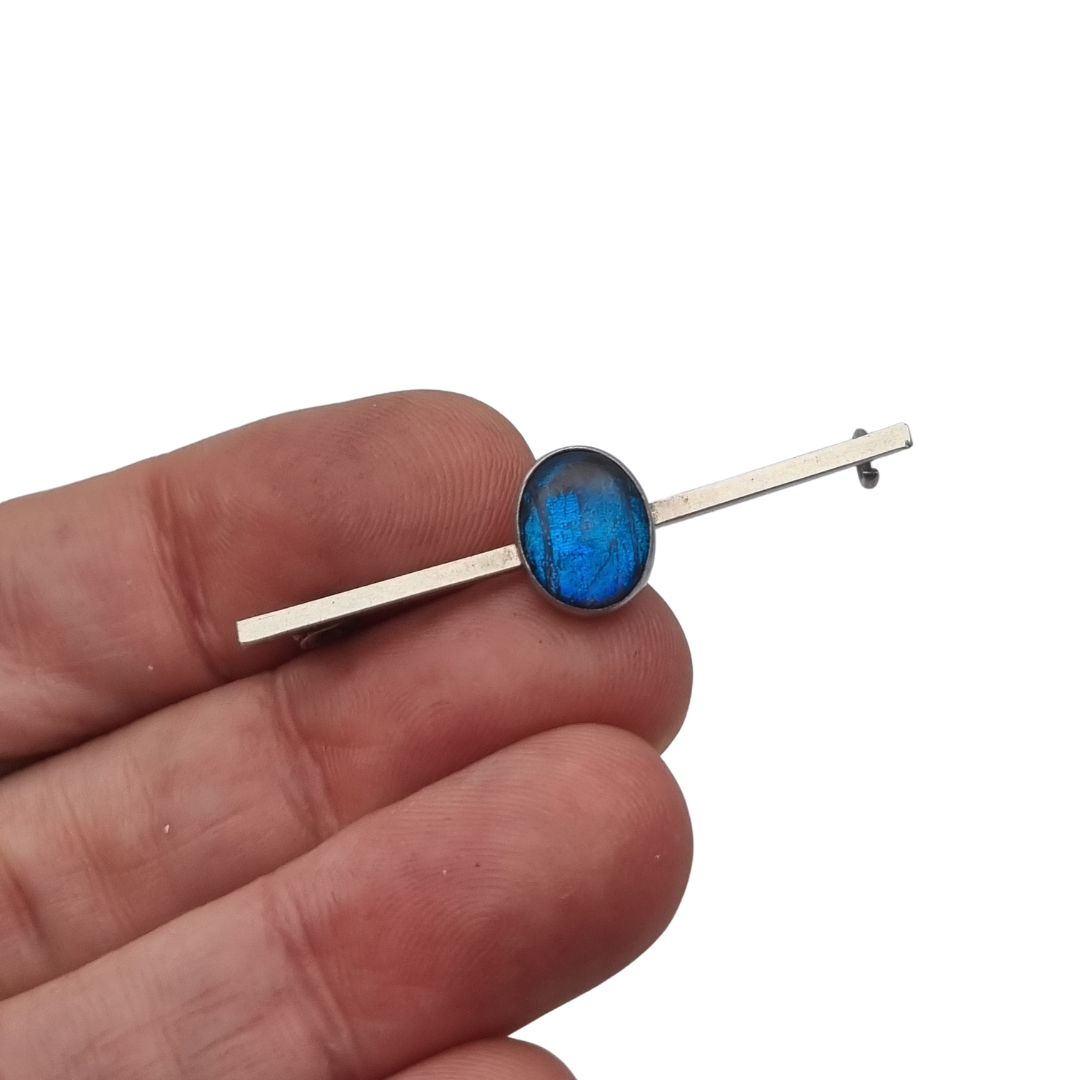 Antique silver brooch with oval blue cabochon, minimalist 20th-century design