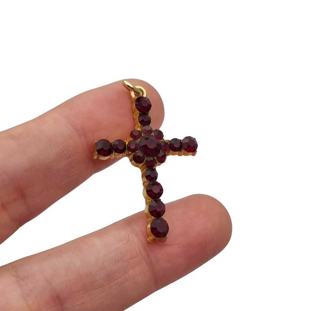Vintage cross with garnet rhinestones and gold-tone metal religious style circa 1950