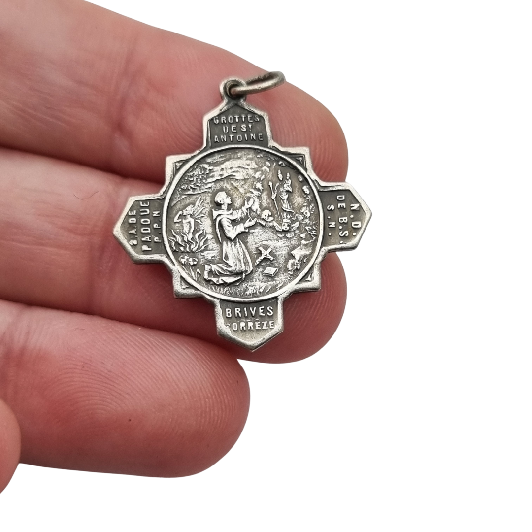 Catholic devotional silver-tone metal Saint Anthony of Padua cross medal, circa 1970