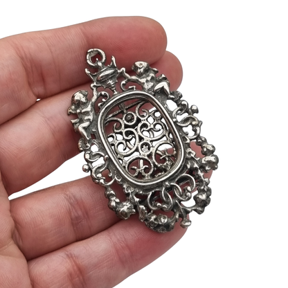 Pierced sterling silver photo frame for a portrait with cherubs, circa 1940-1950