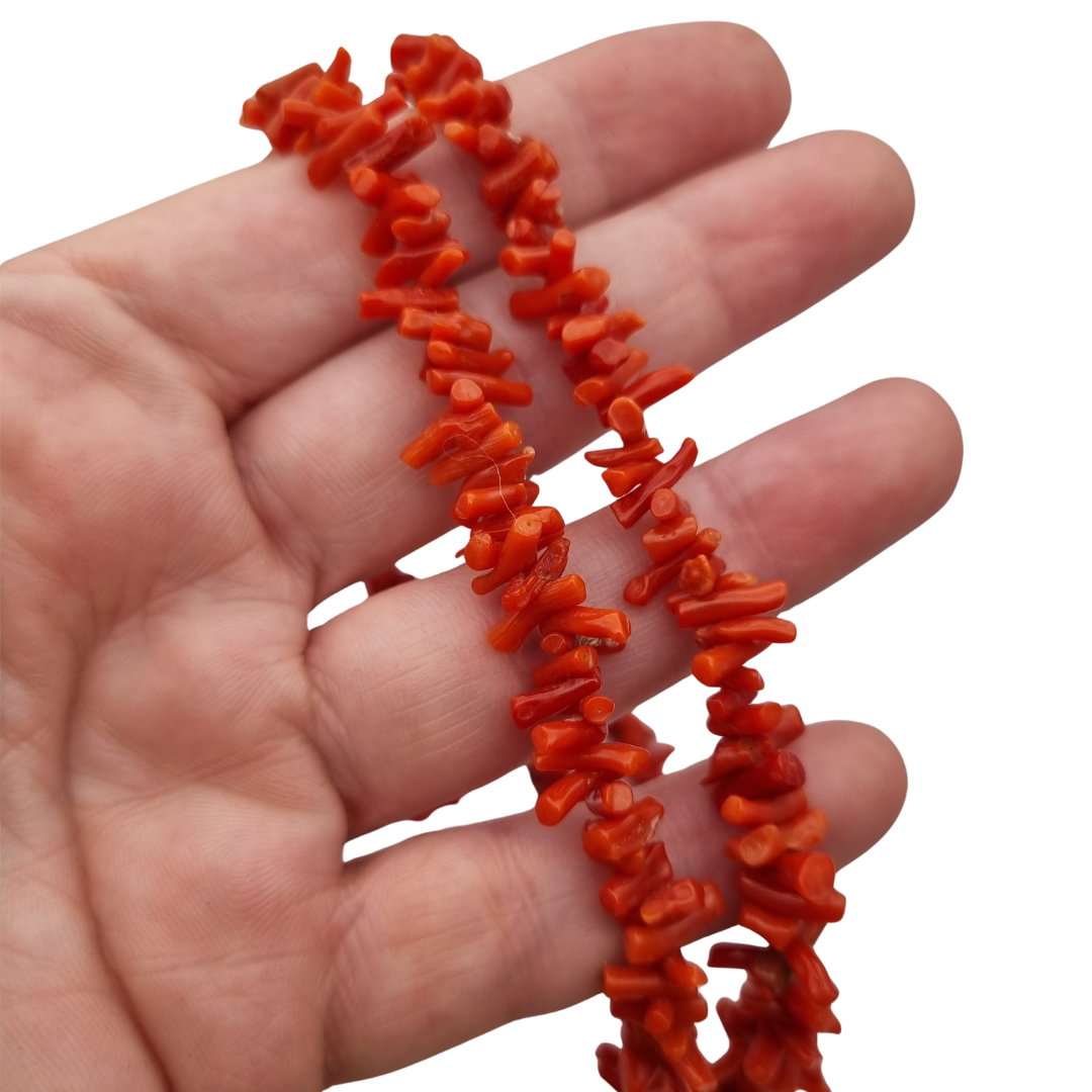 Boho necklace of natural red coral with irregular branches and metal clasp, circa 1970-80