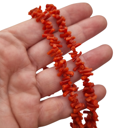 Boho necklace of natural red coral with irregular branches and metal clasp, circa 1970-80