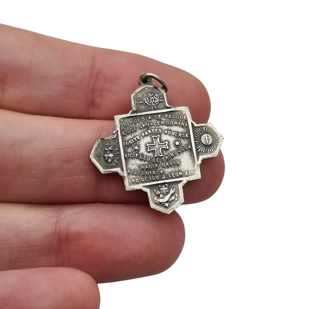 Catholic devotional silver-tone metal Saint Anthony of Padua cross medal, circa 1970