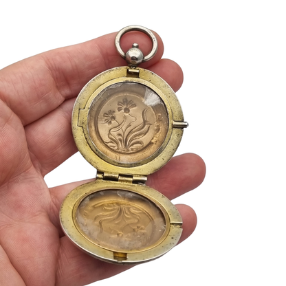 Antique Art Nouveau 800 silver locket with double photo frame, floral engraving, and pink stone, ca. 1900