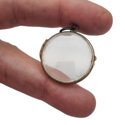 Antique round metal and beveled glass locket pendant, circa 1920