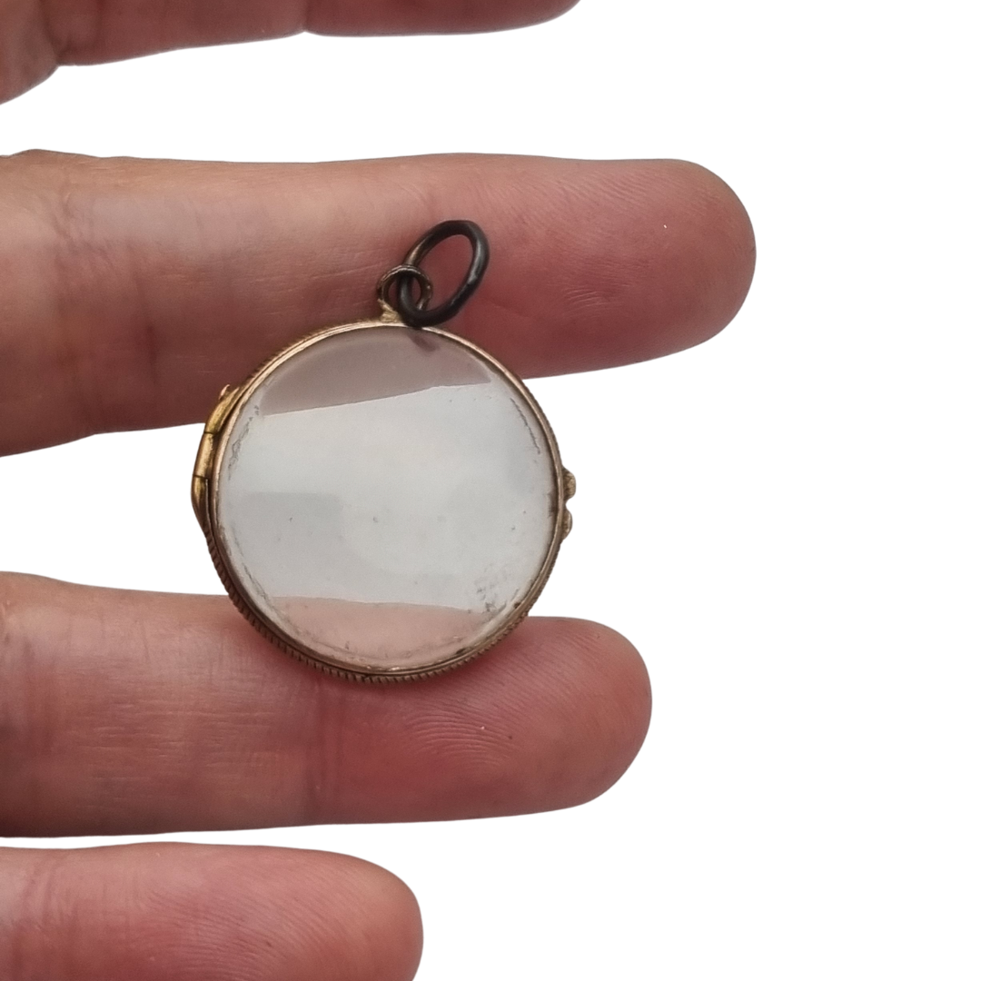 Antique round metal and beveled glass locket pendant, circa 1920