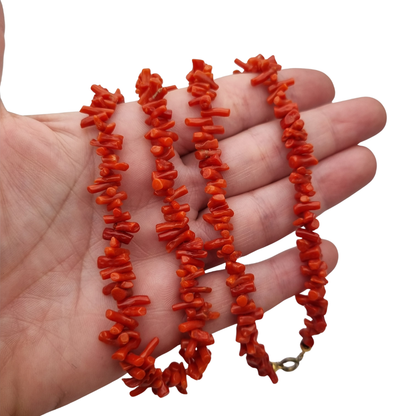 Boho necklace of natural red coral with irregular branches and metal clasp, circa 1970-80
