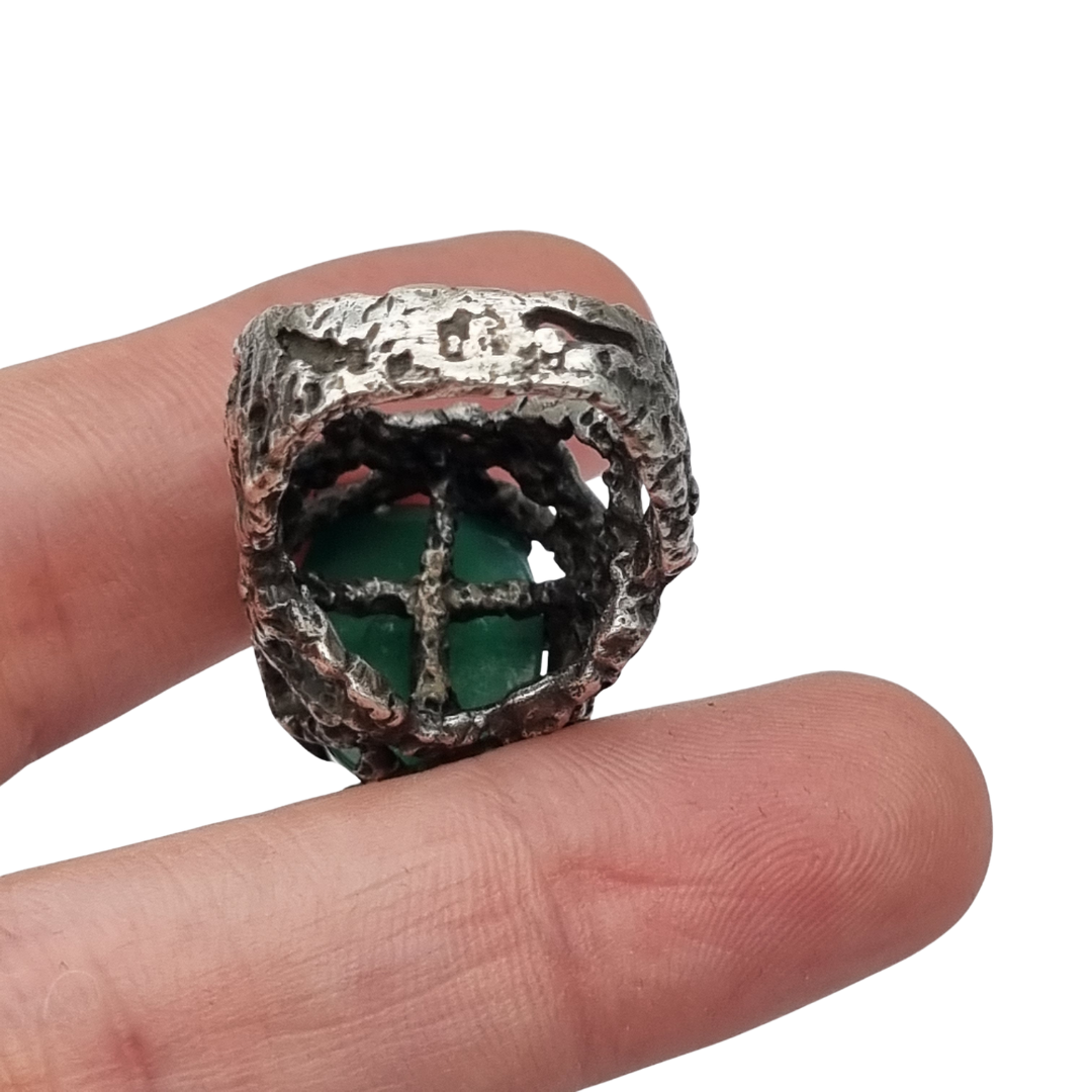Brutalist textured silver ring with green cabochon organic design circa 1970