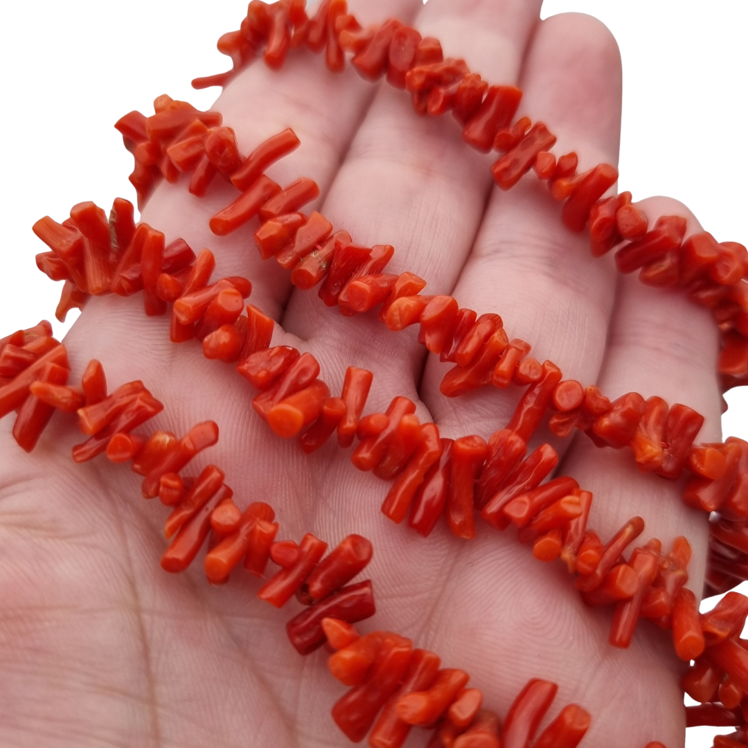 Boho necklace of natural red coral with irregular branches and metal clasp, circa 1970-80