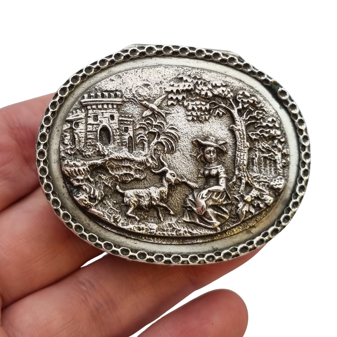 Rococo Revival oval silver box with gilt interior and pastoral scene in relief, circa 1940–1950