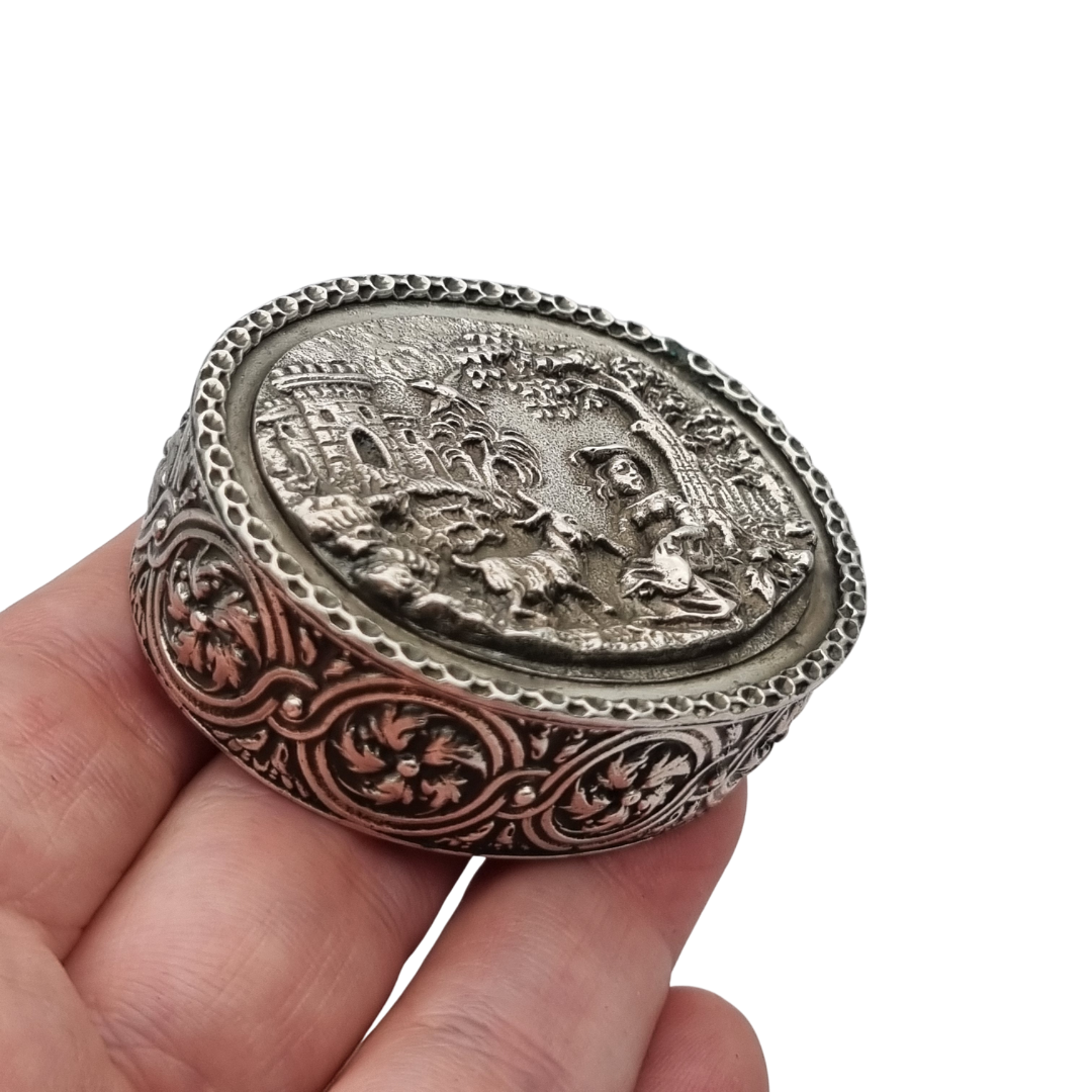 Rococo Revival oval silver box with gilt interior and pastoral scene in relief, circa 1940–1950