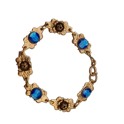 Pulsera religiosa antigua dorada para niña con medallas de esmalte azul.