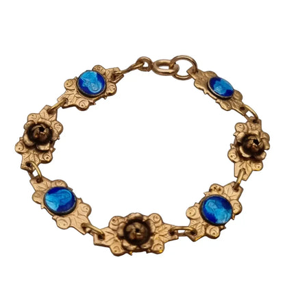 Pulsera religiosa antigua dorada para niña con medallas de esmalte azul.
