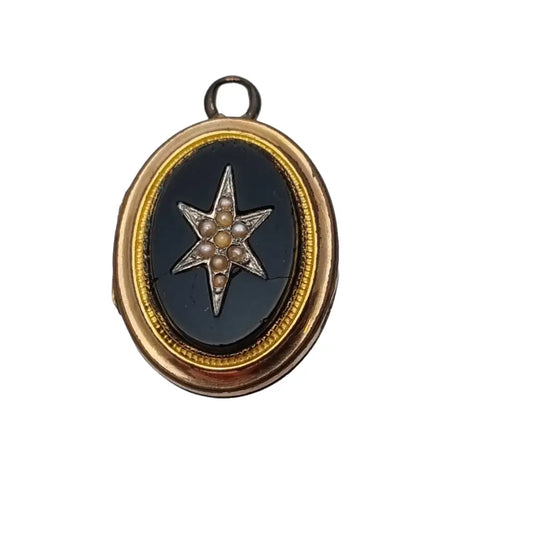 Antiguo guardapelo victoriano ovalado dorado con ónix y estrella de perlas.