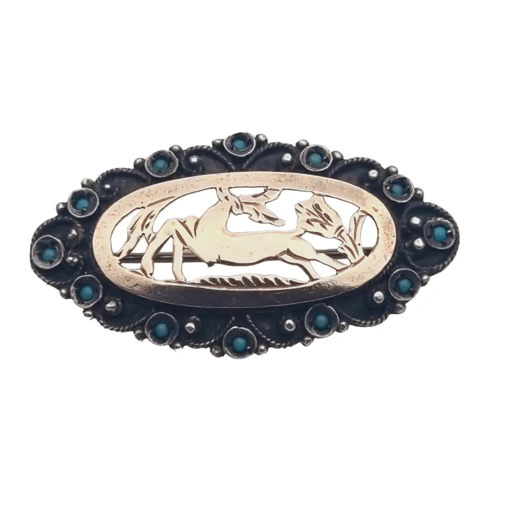 Broche vintage de ciervo en plata 925 calada y marco ovalado con pedrería