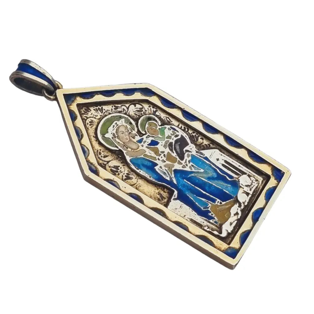 Medalla virgen art nouveau en plata dorada y esmalte azul modernismo religioso.