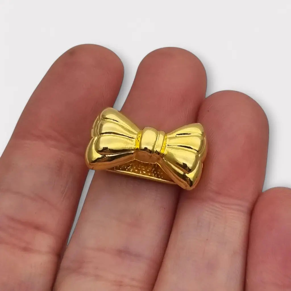 Acortador de collar con lazo dorado elegante y funcional años 80. Gargantilla