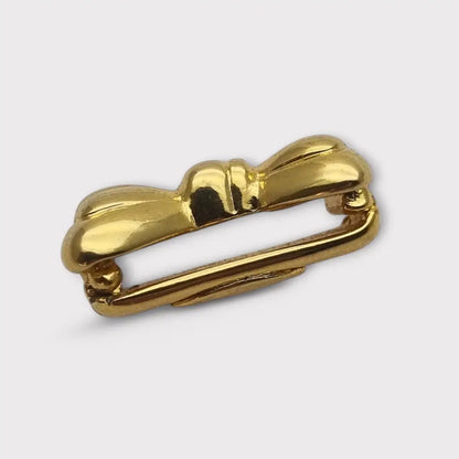 Acortador de collar con lazo dorado elegante y funcional años 80. Gargantilla