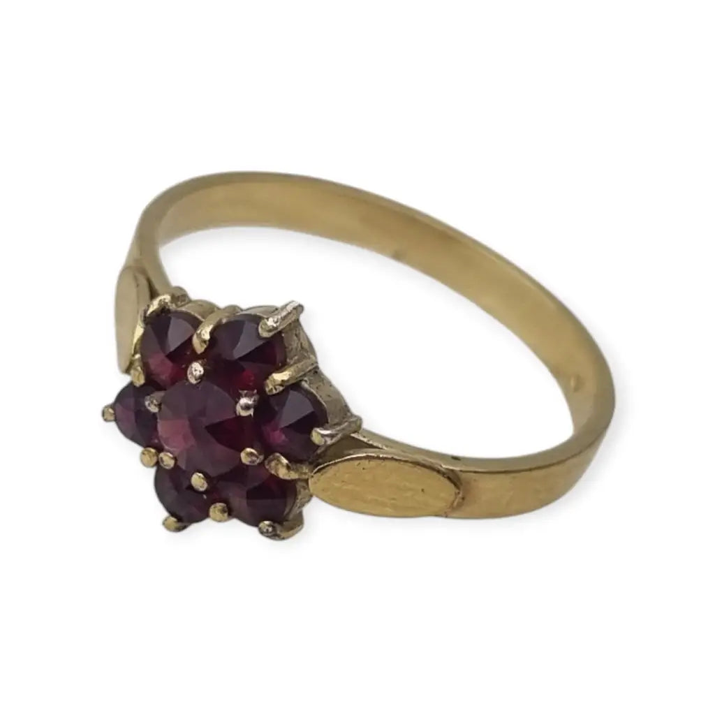 Anillo vintage en plata bañada oro con granates diseño rosetón años 60.
