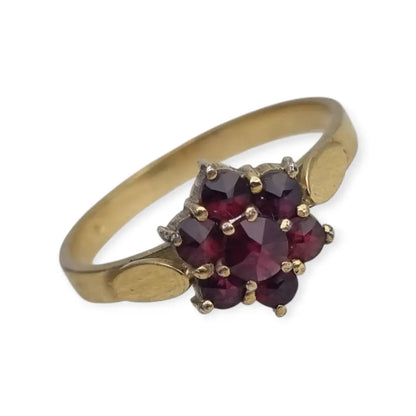 Anillo vintage en plata bañada oro con granates diseño rosetón años 60.