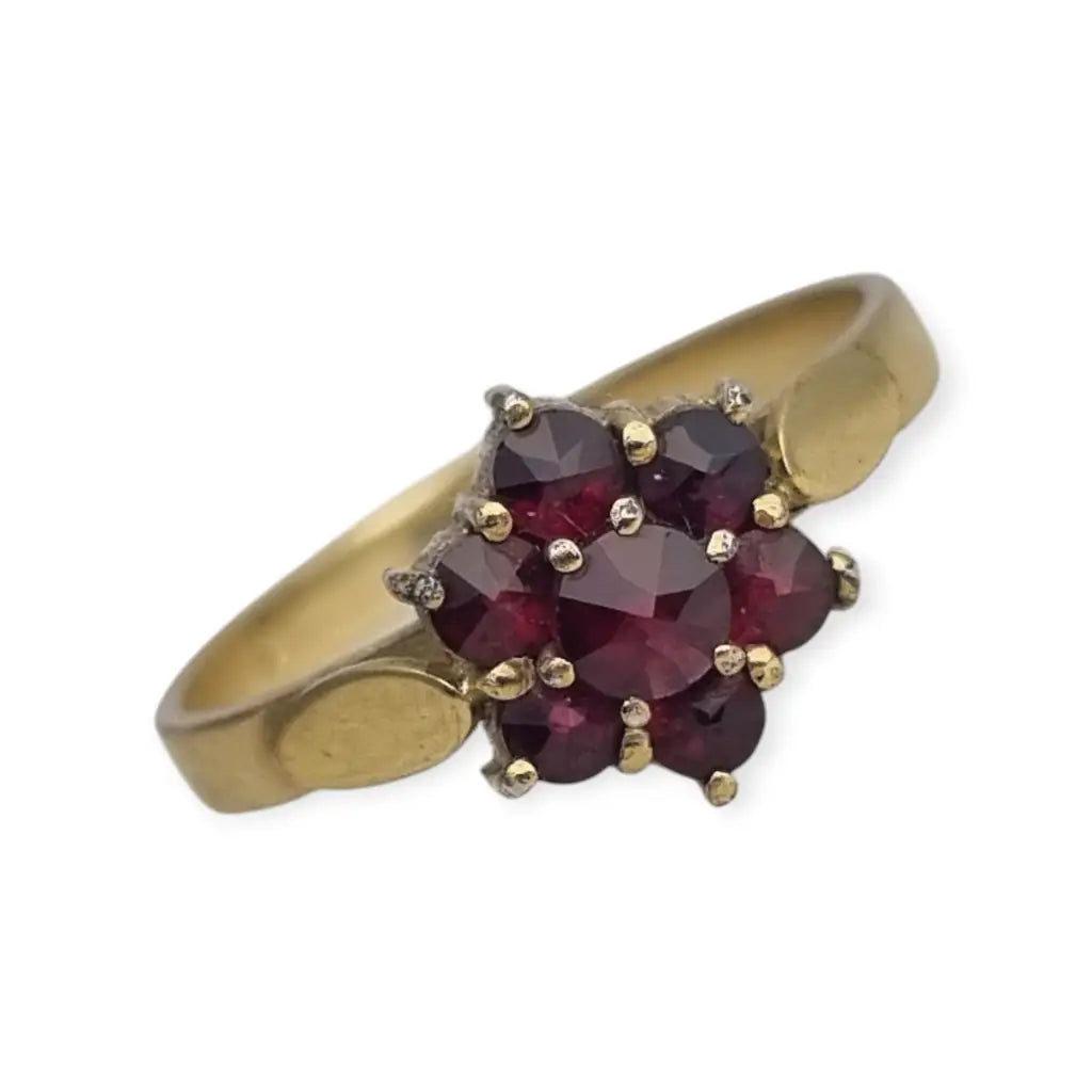 Anillo vintage en plata bañada oro con granates diseño rosetón años 60.