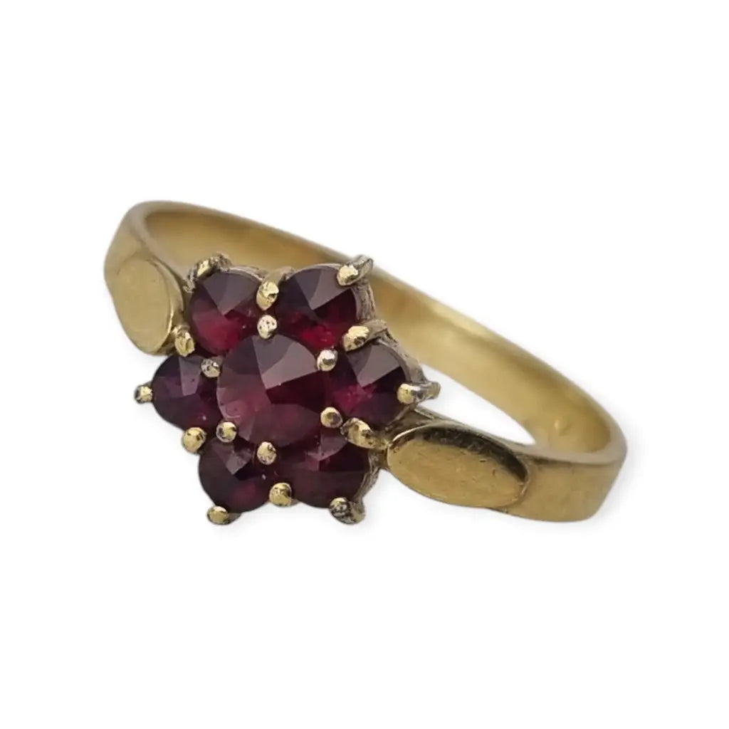 Anillo vintage en plata bañada oro con granates diseño rosetón años 60.