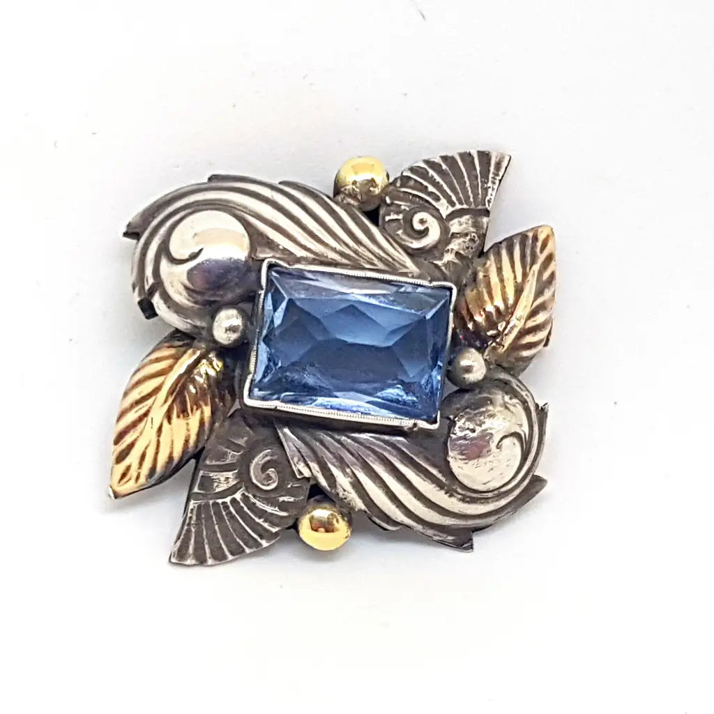 Broche alfiler Art Deco de plata antigua con oro laminado imitación aguamarina