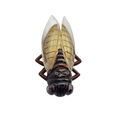 Broche cigarra vintage francesa años 40-50 de lucite en tonos marrones.