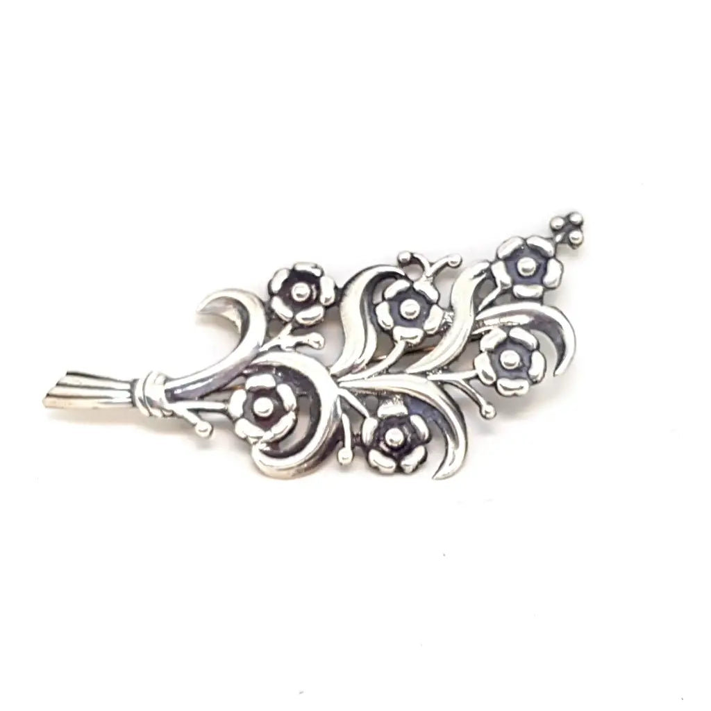Broche flor en plata de primera ley. Circa 1940. Joyería antigua y vintage.
