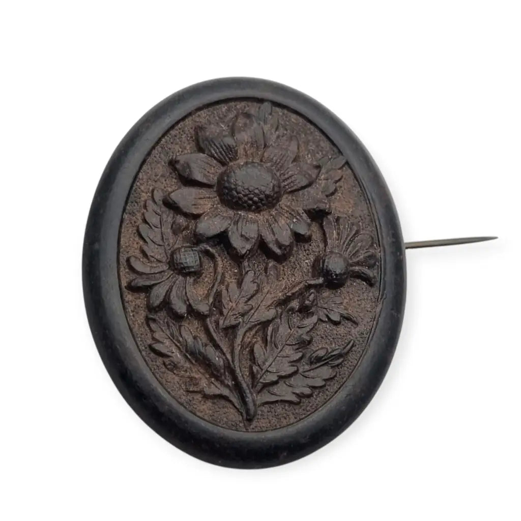 Broche de luto victoriano en camafeo floral negro flores talladas vulcanita