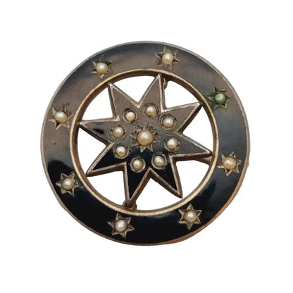 Broche victoriano antiguo estrella 8 puntas de plata esmalte negro y perlas.