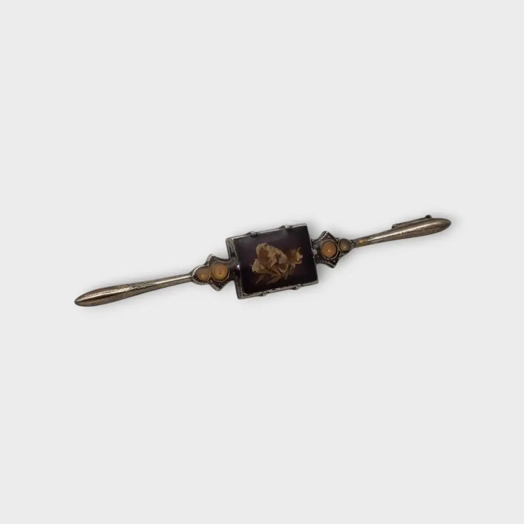 Broche Vintage con flores prensadas encapsuladas circa 1970 estilo art deco.