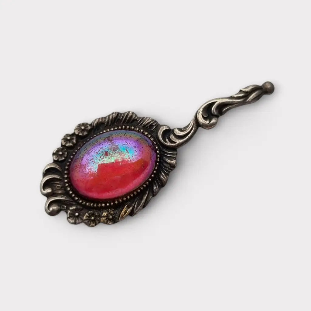 Broche vintage de plata con piedra rosa iridiscente forma alargada los años