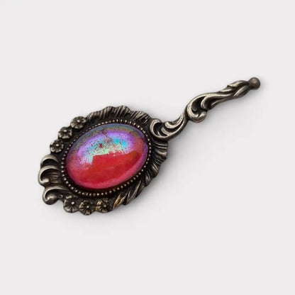 Broche vintage de plata con piedra rosa iridiscente forma alargada los años