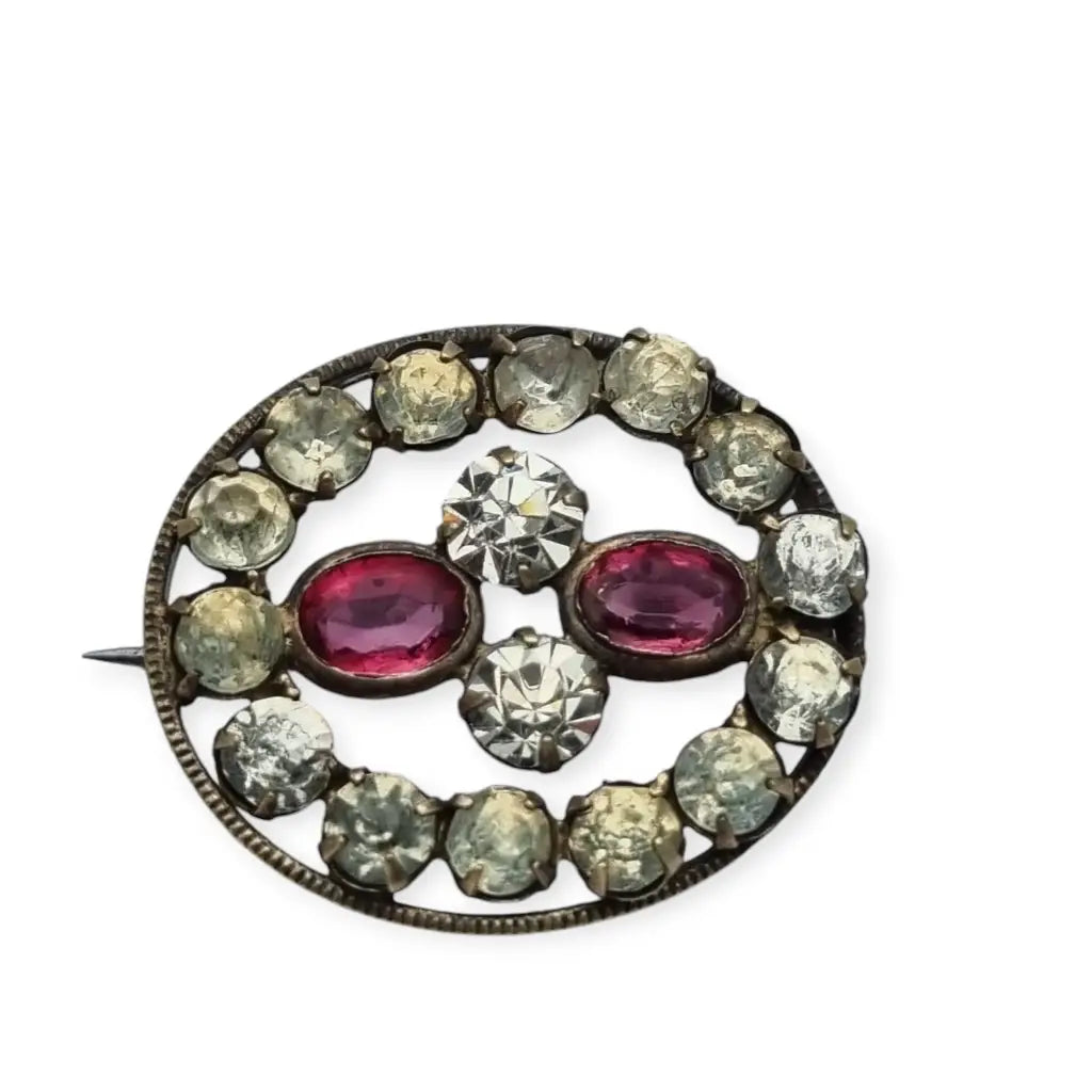 Broche Victoriano antiguo ovalado de mujer con cristales blancos y rosas 1900.