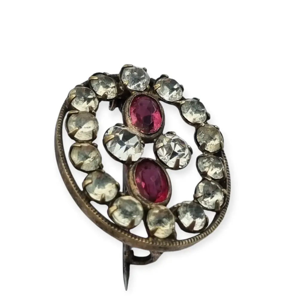 Broche Victoriano antiguo ovalado de mujer con cristales blancos y rosas 1900.