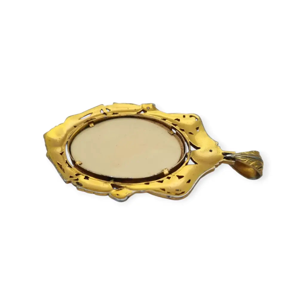 Colgante Art Nouveau de la Virgen década 1910 en celuloide y metal dorado