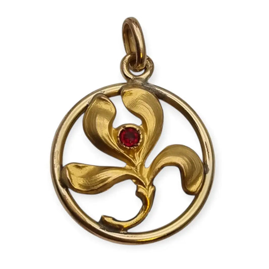 Colgante vintage Art Nouveau dorado con flor en círculo y piedra roja diseño