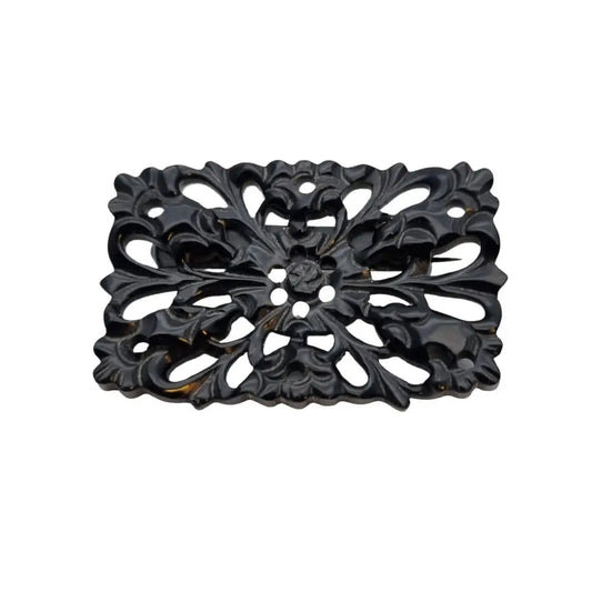 Broche vintage de baquelita tallada negra motivos florales para la solapa