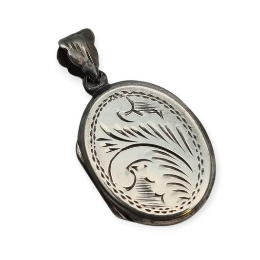 Guardapelo vintage ovalado de plata 925 con grabado vegetal y anilla decorativa