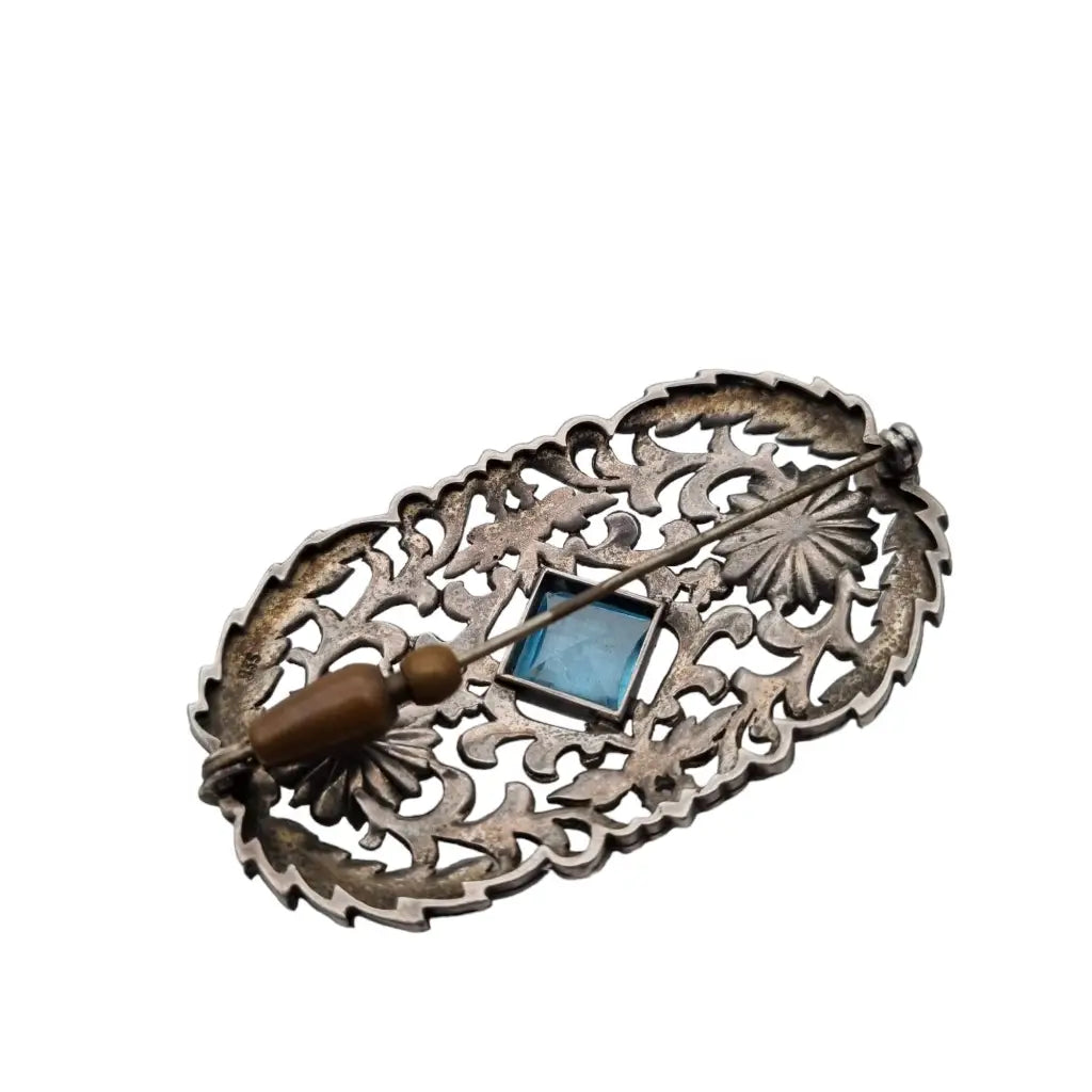 Broche art nouveau en plata 935 con una piedra central azul decorado flores