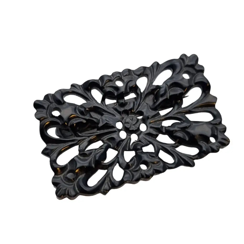 Broche vintage de baquelita tallada negra motivos florales para la solapa