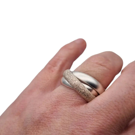Anillo rodante de tres bandas anillo trinidad entrelazada plata ley