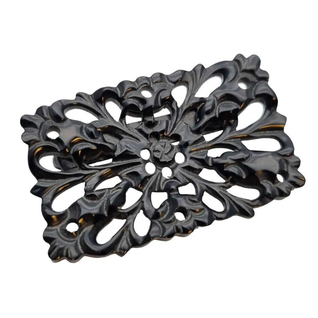 Broche vintage de baquelita tallada negra motivos florales para la solapa