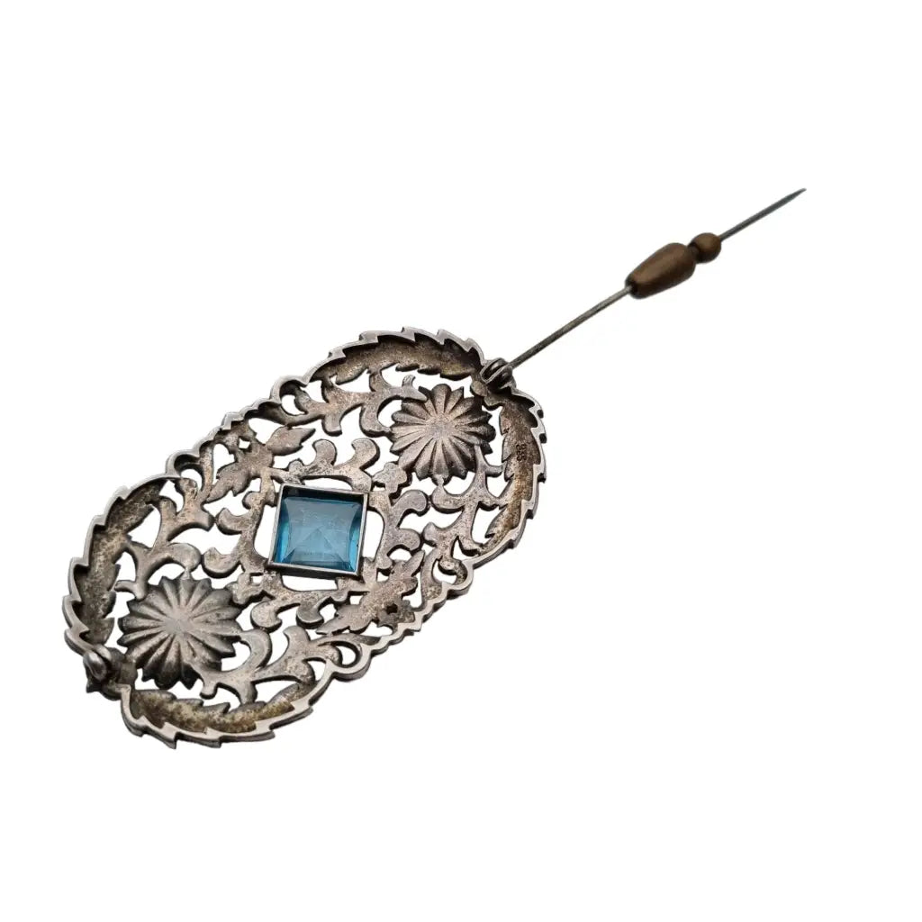 Broche art nouveau en plata 935 con una piedra central azul decorado flores