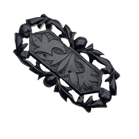 Broche vintage de baquelita negra tallas geométricas para la solapa
