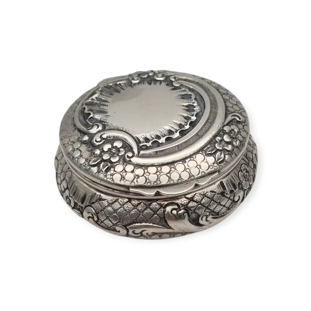 Polvera modernista en plata repujada con espejo interior Art Nouveau ca.